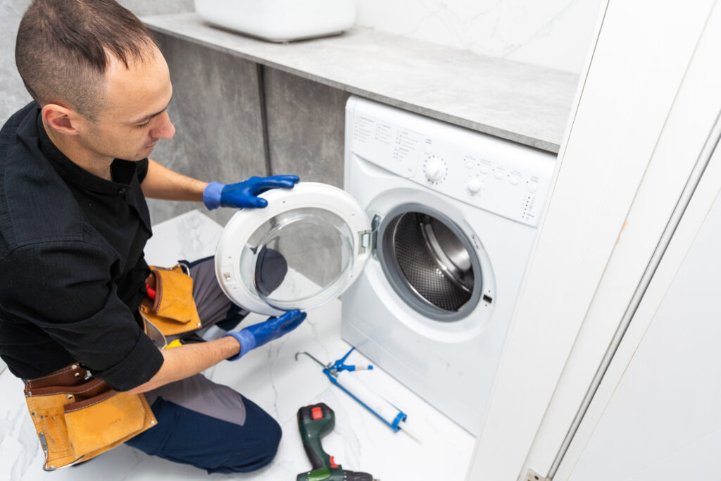 studio photo of washing machine repairman